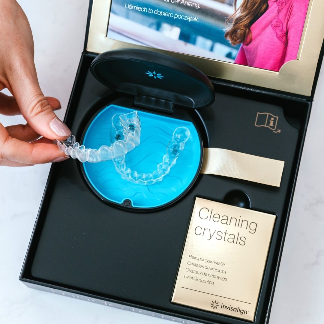 Invisalign aligners being put into their case