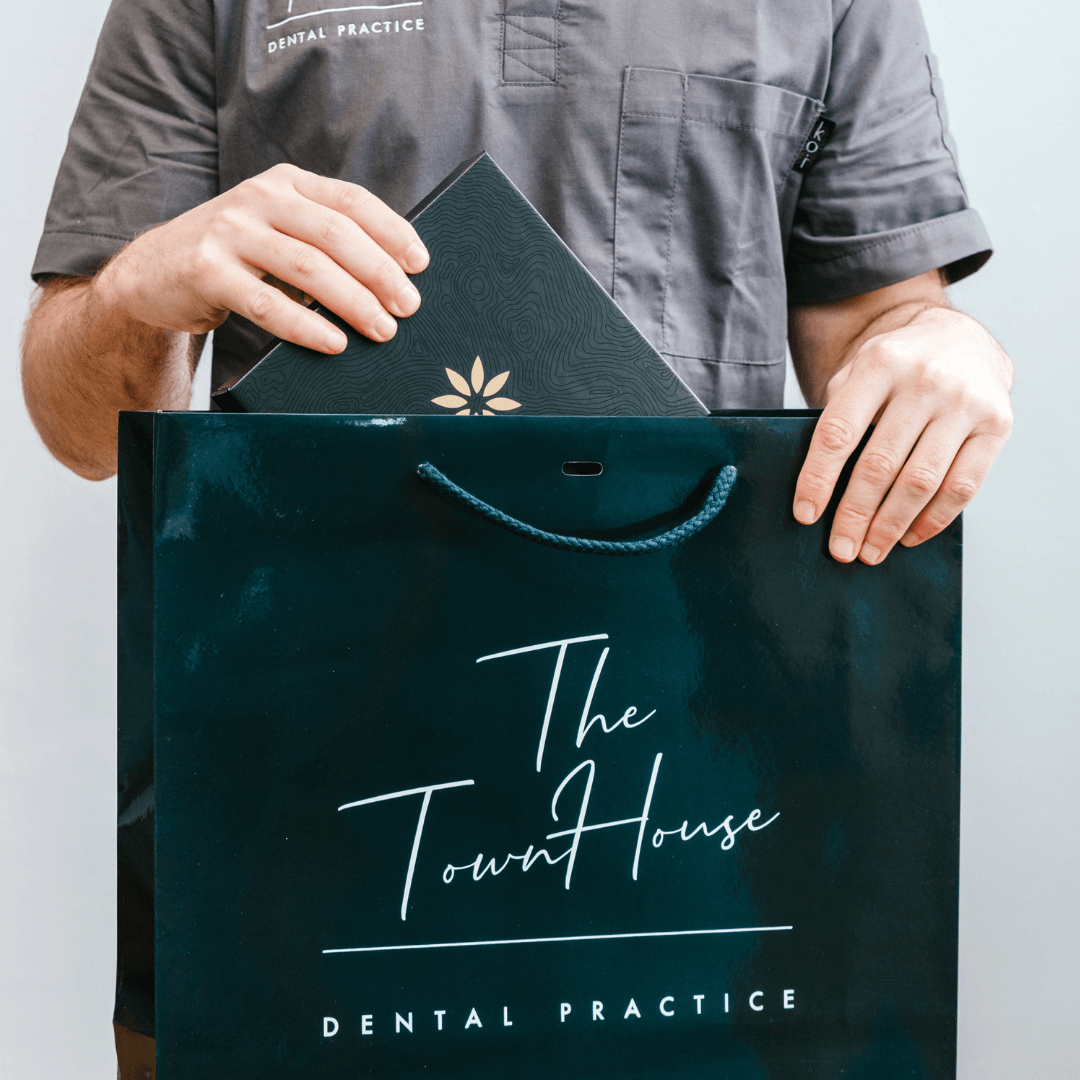 Town House Dental Practice dentist putting Invisalign into bag